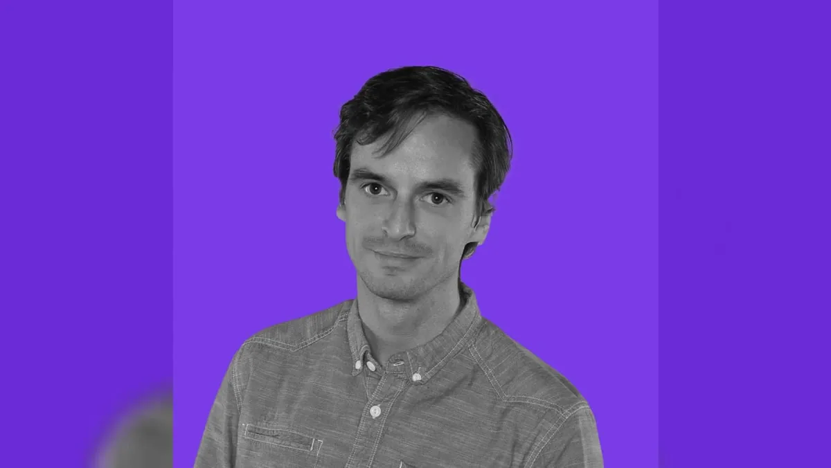 A portrait photo placed sharp over a blurred version of itself to fill a widescreen frame